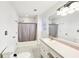 Bathroom featuring white cabinets with a single sink, and a shower tub combo at 4506 Reva Ne Way, Marietta, GA 30066