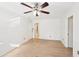 Bedroom featuring hardwood floors, a ceiling fan, and entry to a walk in closet at 4506 Reva Ne Way, Marietta, GA 30066