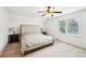 Bright bedroom with a ceiling fan, hardwood floors, and a large bed at 4506 Reva Ne Way, Marietta, GA 30066