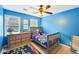 bedroom featuring blue walls, wood floors, and natural light at 4506 Reva Ne Way, Marietta, GA 30066