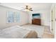 Bedroom featuring a window with blinds, closet, and dresser with television at 4506 Reva Ne Way, Marietta, GA 30066