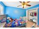 bedroom featuring wood floors, blue walls, natural light, and a closet at 4506 Reva Ne Way, Marietta, GA 30066