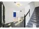 Welcoming foyer with staircase and dark slate tile, leading to a bright living space at 4506 Reva Ne Way, Marietta, GA 30066