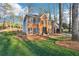 Inviting two-story brick house with lush landscaping and a neatly maintained lawn at 4506 Reva Ne Way, Marietta, GA 30066