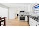 Stylish kitchen showcasing modern appliances, ample cabinetry, and a seamless flow into the dining area at 4506 Reva Ne Way, Marietta, GA 30066