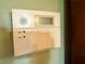 Security alarm panel installed on the wall for home protection at 712 Copper Trace Way, Woodstock, GA 30189