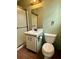 Bathroom featuring a standard toilet, vanity, and shower with a glass door at 712 Copper Trace Way, Woodstock, GA 30189