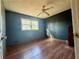 Bedroom featuring wood-look floors, a ceiling fan, and natural light at 712 Copper Trace Way, Woodstock, GA 30189