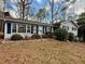 Charming home with blue siding, black shutters and an inviting front yard at 712 Copper Trace Way, Woodstock, GA 30189