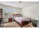 Bedroom featuring a large window for natural light and carpeted floors at 7808 Rutgers Cir, Fairburn, GA 30213