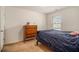 A bedroom with neutral carpet, a window and a dresser at 7808 Rutgers Cir, Fairburn, GA 30213