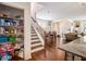 View of staircase and dining area with adjacent pantry and view of living room at 7808 Rutgers Cir, Fairburn, GA 30213