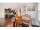 Dining area and kitchen featuring dark cabinetry and a stylish breakfast bar at 7808 Rutgers Cir, Fairburn, GA 30213