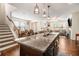 Well-lit open kitchen with stainless steel sink and barstool seating at 7808 Rutgers Cir, Fairburn, GA 30213