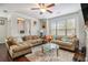 Inviting living room with plush sofas and a large window for natural light at 7808 Rutgers Cir, Fairburn, GA 30213