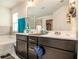 Bathroom featuring a double vanity, bathtub, and a walk-in closet at 7808 Rutgers Cir, Fairburn, GA 30213