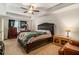 Spacious main bedroom features a large bed, ceiling fan, and ample natural light at 7808 Rutgers Cir, Fairburn, GA 30213