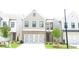 Charming two-story home with a brick and siding exterior and an attached two-car garage at 1067 Crest Mill Dr, Marietta, GA 30008
