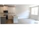 Eat-in kitchen with quartz countertops, stainless appliances, pendant lighting and light wood floors at 1067 Crest Mill Dr, Marietta, GA 30008