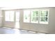 Bright living room with multiple windows offering ample natural light and backyard view at 1067 Crest Mill Dr, Marietta, GA 30008