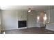 Spacious living room with a modern fireplace, wood floors, and elegant lighting at 1067 Crest Mill Dr, Marietta, GA 30008