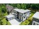 Contemporary home features a modern design, large garage, and a private backyard with a pool at 1291 Sunderland Ct, Atlanta, GA 30319