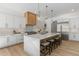 Modern kitchen with a large island, marble countertops, stainless steel appliances, and light wood floors at 1291 Sunderland Ct, Atlanta, GA 30319