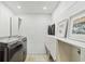 Well-organized laundry room with modern washer/dryer and ample storage space at 2125 Datona Sw Dr, Atlanta, GA 30331