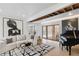 Sunlit living room with white furniture, a piano, and glass doors to the outdoors, perfect for entertaining at 2125 Datona Sw Dr, Atlanta, GA 30331