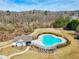 Aerial view of the community pool, pool house, and surrounding green space, showcasing the community amenities at 4825 Marco Ln, Cumming, GA 30028