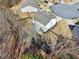 Overhead shot of a well-maintained single-Gathering home with a fenced yard in a suburban neighborhood at 4825 Marco Ln, Cumming, GA 30028