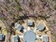 Aerial view highlighting the arrangement of homes around a cul-de-sac, each with fenced yards at 4825 Marco Ln, Cumming, GA 30028