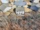 Aerial view of homes in a cul-de-sac, showcasing the neighborhood layout and fenced-in backyards at 4825 Marco Ln, Cumming, GA 30028