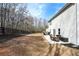 Expansive backyard view with patio featuring both dining and sitting areas for relaxation and entertainment at 4825 Marco Ln, Cumming, GA 30028