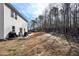 Wide backyard view with patio dining and sitting areas, ideal for enjoying the outdoors at 4825 Marco Ln, Cumming, GA 30028