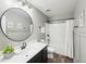 Clean bathroom featuring a white vanity, shower-tub combination, and framed artwork at 4825 Marco Ln, Cumming, GA 30028