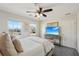 Comfortable bedroom with bright natural light, a ceiling fan, and a flatscreen tv at 4825 Marco Ln, Cumming, GA 30028