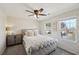 Relaxing bedroom with a tufted headboard, lots of natural light, and neutral tones at 4825 Marco Ln, Cumming, GA 30028