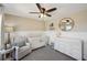 Adorable Bedroom featuring a crib, comfy seating, and a light-colored changing table at 4825 Marco Ln, Cumming, GA 30028