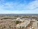 Panoramic view of a neighborhood nestled amongst trees, extending to a distant mountain range at 4825 Marco Ln, Cumming, GA 30028