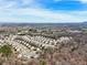 Sprawling neighborhood showcases orderly rows of houses extending towards a distant mountain range at 4825 Marco Ln, Cumming, GA 30028