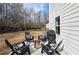 Inviting backyard patio with Adirondack chairs and a modern fire pit, perfect for outdoor gatherings at 4825 Marco Ln, Cumming, GA 30028