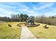 Community playground featuring a modern play structure, mulch ground cover, benches, and easy access via a paved walkway at 4825 Marco Ln, Cumming, GA 30028