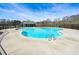 Community pool featuring a beach style entry, crystal clear water, ladder access, and a covered lounge area at 4825 Marco Ln, Cumming, GA 30028