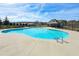 Community pool featuring a beach style entry, crystal clear water, ladder access, and a covered lounge area at 4825 Marco Ln, Cumming, GA 30028