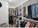 Organized walk-in closet provides ample space for clothing and accessories at 4825 Marco Ln, Cumming, GA 30028