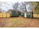 Backyard view of green siding, shed, and a wooden fence at 973 Parsons Sw St, Atlanta, GA 30314