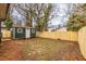 View of fenced backyard with shed in the back at 973 Parsons Sw St, Atlanta, GA 30314