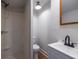 Bathroom with a white vanity, dark faucet, and a walk-in shower at 973 Parsons Sw St, Atlanta, GA 30314