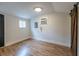 Bedroom with wood-look vinyl flooring and neutral paint at 973 Parsons Sw St, Atlanta, GA 30314